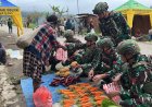 Tingkatkan Roda Perekonomian di Papua, Satgas Yonif 711/Raksatama Borong Hasil Bumi Warga Lokal